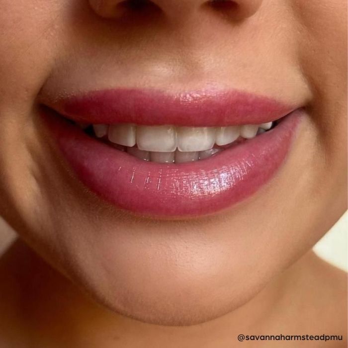 Close up of smile with results of a lip blush treatment